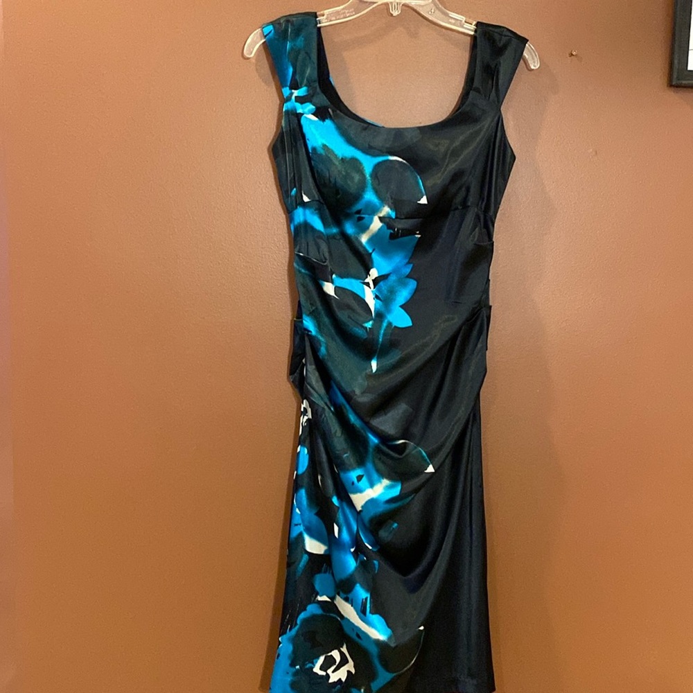Jessica ladies dress in size 6 petite. Black with floral detailing.